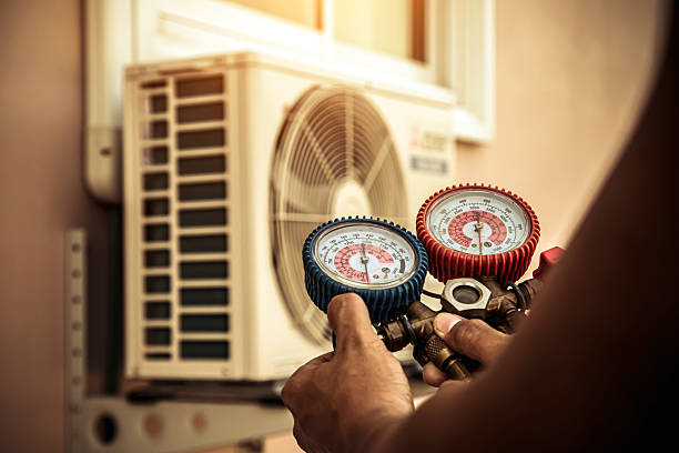 Professional Air Conditioning Service technician working in Hot Springs National Park, AR